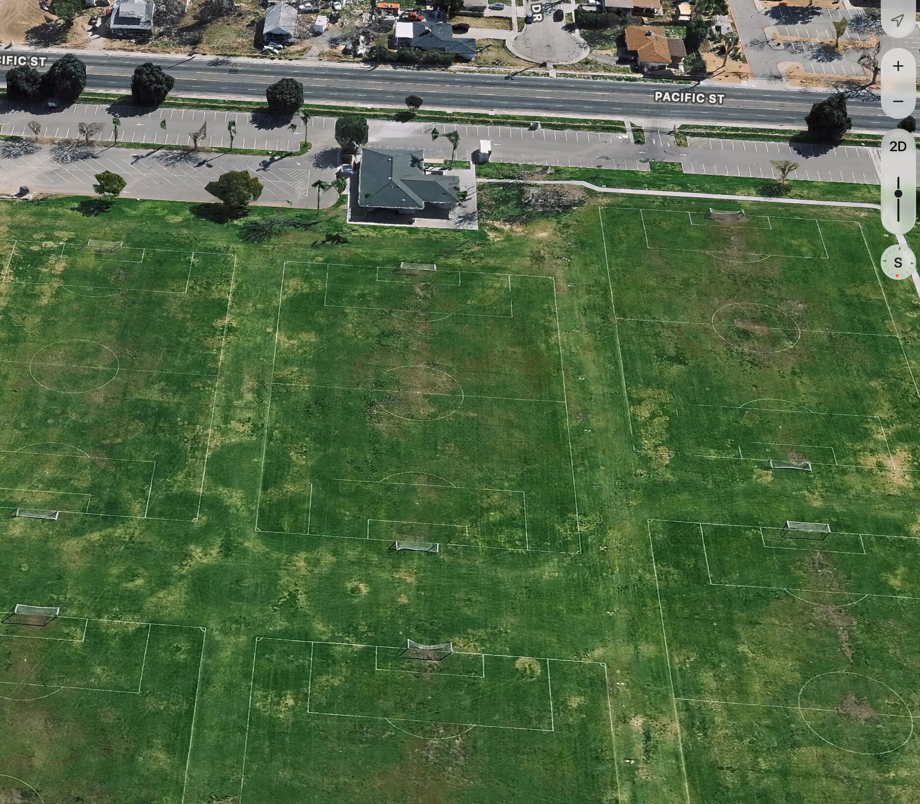 Aerial view showing Pacific Street, parking, clubhouse and soccer fields